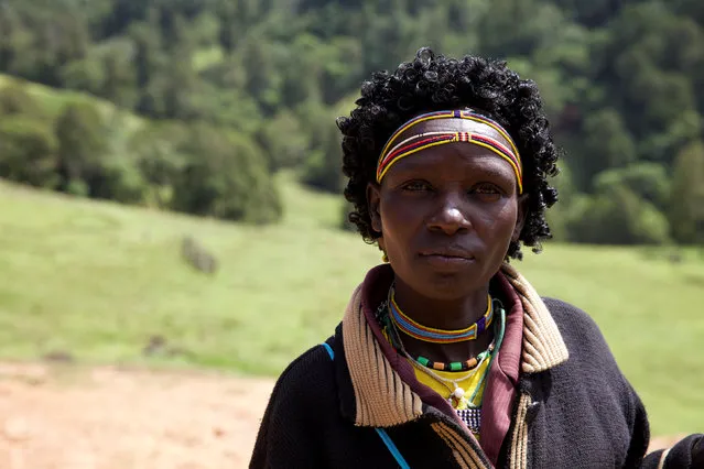 A woman from the Sengwer community poses for a photograph after protesting over their eviction from their ancestral lands, Embobut Forest, by the government for forest conservation in western Kenya, April 19, 2016. (Photo by Katy Migiro/Reuters)