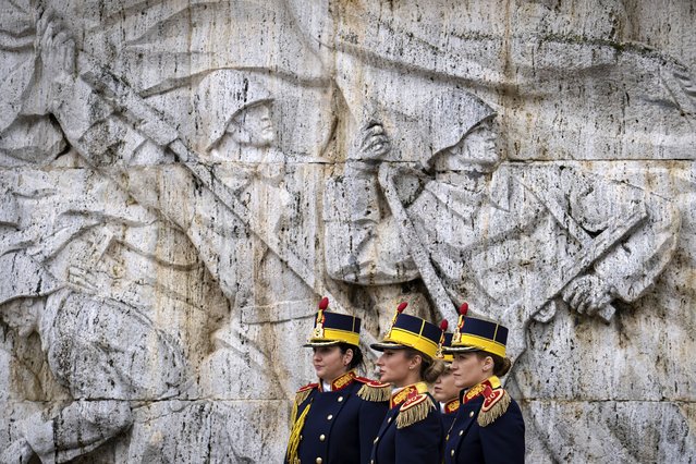 Members of a Romanian honor guard attend a transfer of authority ceremony from the 101st Airborne Division to the 10th Mountain Division in Bucharest, Romania, Wednesday, April 5, 2023. U.S. troops are deployed to Romania along with forces from other NATO member states as the alliance looks to boost security on its southeastern flank amid Russia's war in Ukraine. (Photo by Andreea Alexandru/AP Photo)