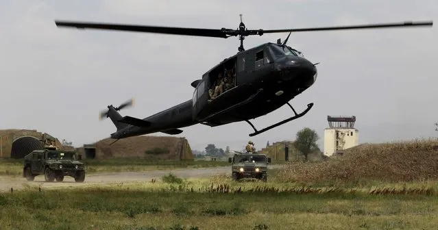 A Georgian military helicopter takes part in a joint NATO-Georgia military exercise at a military base in Vaziani, outside Tbilisi, Georgia, Tuesday, July 21, 2015. (Photo by Shakh Aivazov/AP Photo)