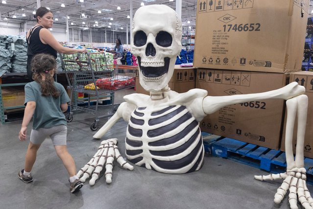 Customers walk past Halloween decorations for sale at a Costco store in Washington, DC, USA, 08 August 2024. New data released by the US department of labor showing a drop in new unemployment claims drove the S&P 500 to advance 2.3 percent – posting its best day since 2022. (Photo by Michael Reynolds/EPA/EFE)