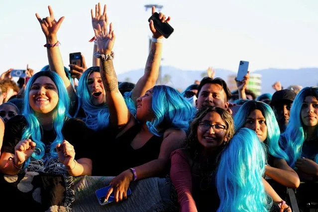 A crowd of blue wigs is seen as Karol G performs at the Coachella Valley Music and Arts Festival held at the Empire Polo Club in Indio, California, U.S., April 24, 2022. (Photo by Maria Alejandra Cardona/Reuters)