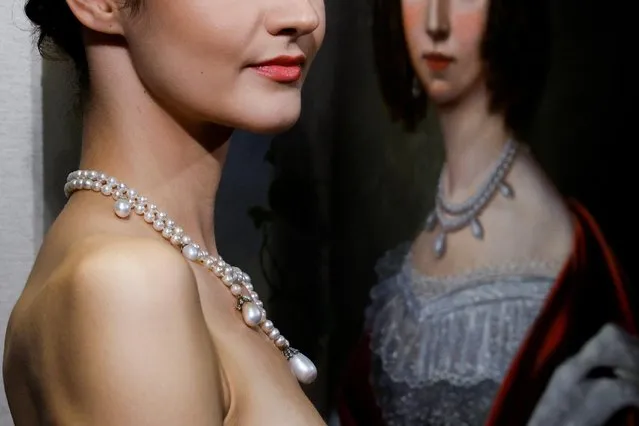 A model poses with the 19th-century necklace belonging to Queen Josephine of Sweden, during a preview at Sotheby's before its auction in Hong Kong, China on September 29, 2021. (Photo by Tyrone Siu/Reuters)