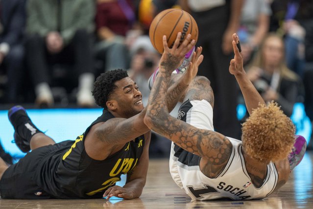 Utah Jazz forward Brice Sensabaugh (28) goes for a loose ball along with San Antonio Spurs forward Jeremy Sochan (10), during the second half of an NBA basketball game, Thursday, October 31, 2024, in Salt Lake City. (Photo by Rick Egan/AP Photo)