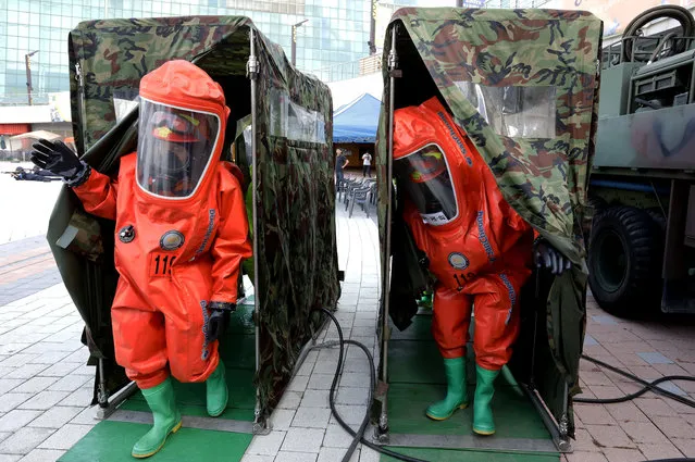 Emergency services personnel wearing protective clothing participate in an anti-terror and anti-chemical terror exercise as part of the 2017 Ulchi Freedom Guardian (UFG) at Kintex on August 21, 2017 in Goyang, South Korea. The computer simulation war game exercises, taking place through August 31, has been denounced as a provocation from North Korea, citing it is a “rehearsal of invasion to North”, may cause flaring up further tension between Pyongyang and Washington. North Korea responded to the exercise with a nuclear test last year. (Photo by Chung Sung-Jun/Getty Images)