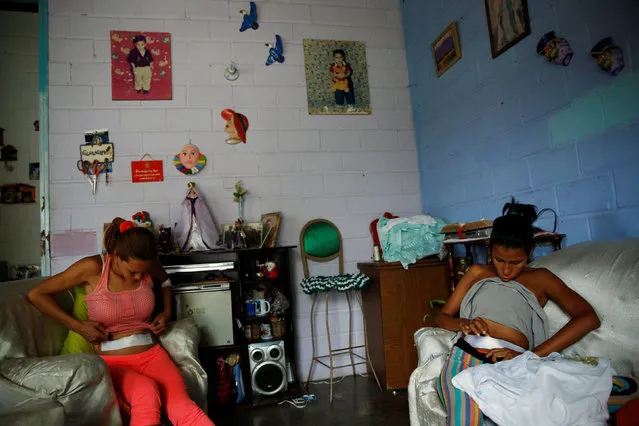 Alejandra Jordan (R), 30, and her sister Andreina Jordan, 34, recover after sterilization surgery at their home in San Francisco de Yare, Venezuela July 28, 2016. (Photo by Carlos Garcia Rawlins/Reuters)