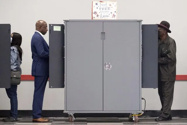 U.S. Sen. Raphael Warnock, D-Ga., votes on the first day of early voting in Atlanta on Monday, October 17, 2022. (Photo by Ben Gray/AP Photo)