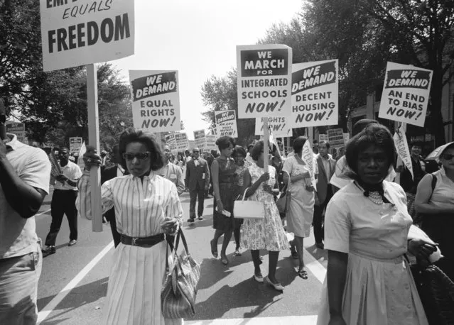The civil rights march on Washington with a procession of African Americans carrying signs for equal rights and integrated schools, Washington DC, August 28, 1963. (Photo by Warren K Leffler/Underwood Archives/Getty Images)