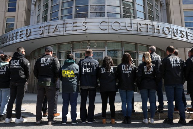 Members of the Drug Enforcement Administration (DEA) line up for a photo outside of the Brooklyn Federal Courthouse on the day of a hearing for Guadalajara Cartel co-founder Rafael Caro Quintero in Brooklyn, New York on March 26, 2025. (Photo by Kylie Cooper/Reuters)