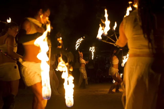 Fire dancers perform during Wasteland Weekend event in California City, California September 26, 2015. (Photo by Mario Anzuoni/Reuters)