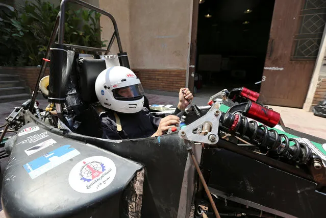 An Egyptian university student sits behind the wheel of a racing car his team built to compete at the Formula Student UK in Cairo, Egypt September 2, 2016. (Photo by Mohamed Abd El Ghany/Reuters)