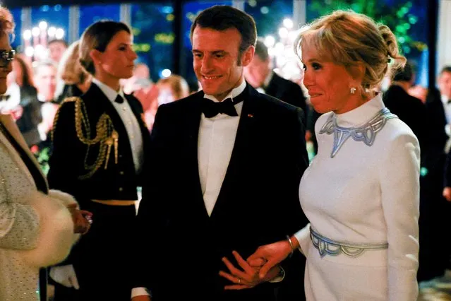 France's President Emmanuel Macron and his wife Brigitte Macron attend a State Dinner hosted by U.S. President Joe Biden and U.S. first lady Jill Biden on the South Lawn of the White House, in Washington, U.S., December 1, 2022. (Photo by Evelyn Hockstein/Reuters)
