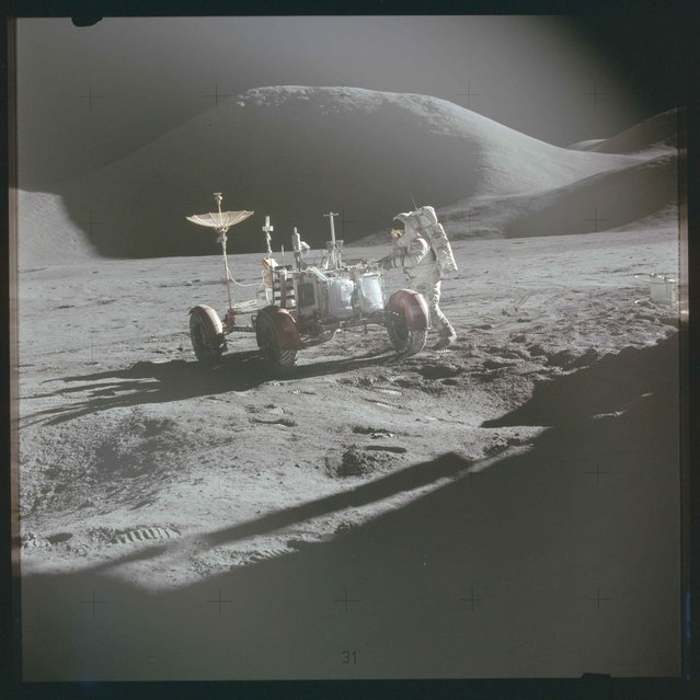 Astronaut David R. Scott, commander, approaches the Lunar Roving Vehicle (LRV) during the Apollo 15 mission in this July 1971 NASA handout photo. (Photo by Reuters/NASA)