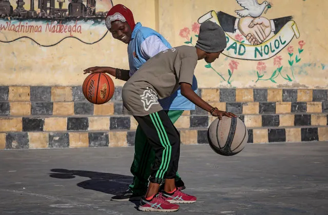 Somali women train at a basketball court within Hamar Jajab district of Mogadishu, Somalia on September 16, 2020. (Photo by Feisal Omar/Reuters)