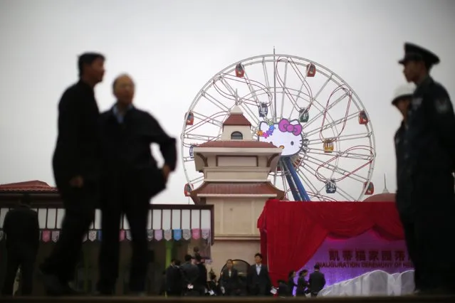 Guests arrive at an inauguration ceremony of a Hello Kitty amusement park in Anji, Zhejiang province November 28, 2014. (Photo by Carlos Barria/Reuters)