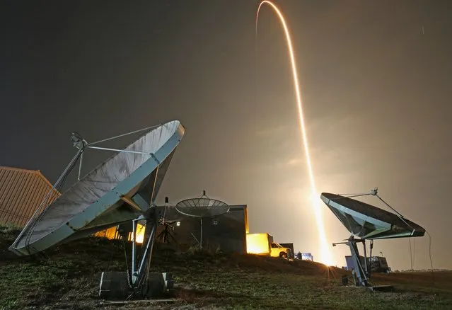 This timed exposer shows the trail as the SpaceX Falcon 9 rocket with the company’s Crew Dragon spacecraft lifts off from pad 39A for the Crew-6 mission at NASA's Kennedy Space Center in Cape Canaveral, Florida, early on March 2, 2023. NASA’s SpaceX Crew-6 mission is the sixth crew rotation mission of the SpaceX Crew Dragon spacecraft and Falcon 9 rocket to the International Space Station as part of the agency’s Commercial Crew Program. (Photo by Gregg Newton/AFP Photo)