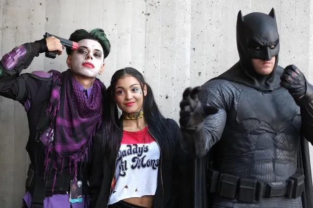 Cosplayer's dressed as The Joker, Harley Quinn and Batman attend the New York Comic Con 2016 at The Jacob K. Javits Convention Center on October 7, 2016 in New York City. New York Comic Con is one of the largest comic book and science fiction conventions. The convention brings together fans of fantasy role playing, science fiction, movies and television. (Photo by Neilson Barnard/Getty Images)