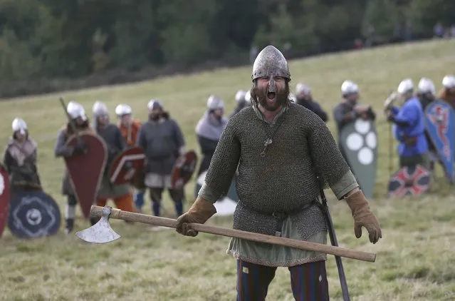 Re-enactors participate in a demonstration before a re-enactment of the the Battle of Hastings on the 950th anniversary of the battle, in Battle, Britain October 15, 2016. (Photo by Neil Hall/Reuters)