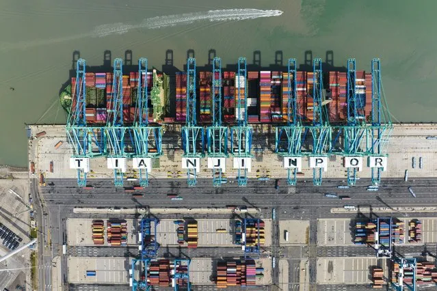 This aerial photo released by Xinhua News Agency, shows a container ship at the smart zero-carbon terminal of Tianjin Port in north China's Tianjin on April 6, 2023. China's exports rebounded unexpectedly to growth in March despite a decline in U.S. and European demand following higher interest rates to cool inflation. (Photo by Han Xilong/Xinhua via AP Photo)
