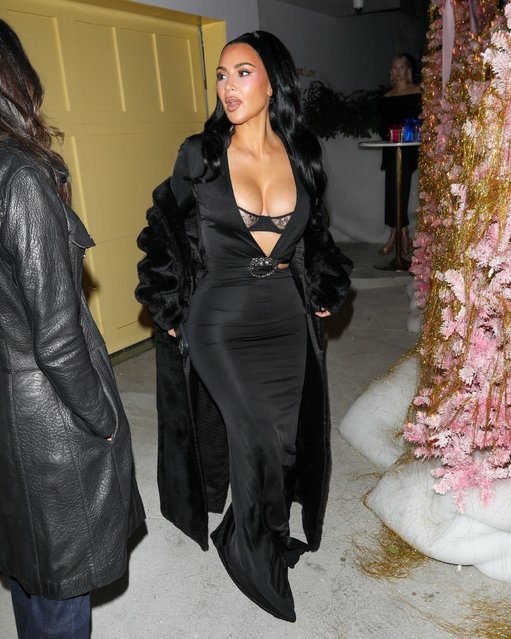 American media personality and socialite Kim Kardashian made a dramatic departure from Vas J Morgan's Hollywood party, stunning in a black gown with a lace-detail bodice and luxe fur-trimmed coat in Los Angeles on December 11, 2025. Surrounded by festive d'cor, she left the venue in true glam style. (Photo by Backgrid USA)