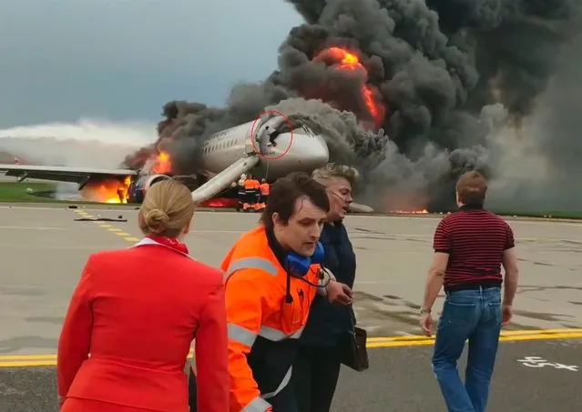 An Aeroflot Sukhoi Superjet-100 (SSJ100) passenger aircraft on fire after crashlanding at Sheremetyevo Airport in Moscow Region, Russia on May 6, 2019. The airliner left Sheremetyevo for Murmansk on May 5 at around 6pm Moscow time, returned and made an emergency landing at around 6.40pm due to a fire aboard; the crashlanding and the fire resulted in multiple casualties. (Photo by East2west News)
