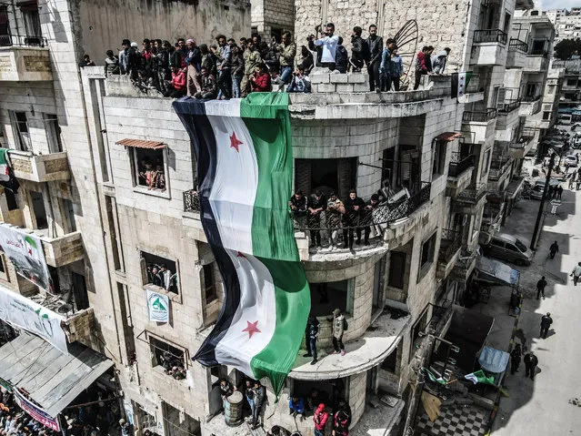 Syrians stage a demonstration against Bashar al-Assad regime as the Syrian civil war entered its 11th year in Idlib, Syria on March 17, 2021. (Photo by Izzeddin Idilbi/Anadolu Agency via Getty Images)