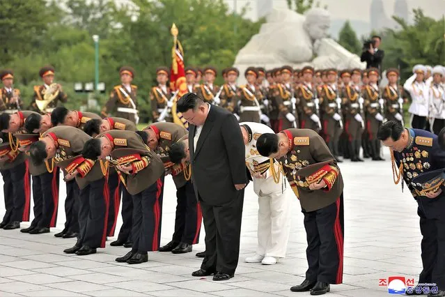In this photo provided by the North Korean government, North Korean leader Kim Jong Un, second right in front, visits a liberation war martyrs cemetery in Pyongyang, North Korea Tuesday, July 25, 2023, on the occasion of the 70th anniversary of the armistice that halted fighting in the 1950-53 Korean War. Independent journalists were not given access to cover the event depicted in this image distributed by the North Korean government. The content of this image is as provided and cannot be independently verified. Korean language watermark on image as provided by source reads: “KCNA” which is the abbreviation for Korean Central News Agency. (Photo by Korean Central News Agency/Korea News Service via AP Photo)