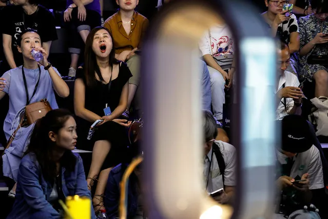 Attendees wait for a Dyson product launch event to begin in Beijing, China on September 12, 2018. (Photo by Damir Sagolj/Reuters)