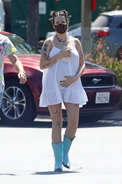 Pregnant American singer Halsey stepped out for coffee on Wednesday, May 26, 2021 in Malibu wearing a ring with boyfriend Alev Aydin.  Dressed in a white dress and light blue cowgirl boots, Halsey, 26, displayed her growing baby bump as she and Aydin, 38, walked through a parking lot. (Photo by Backgrid USA)