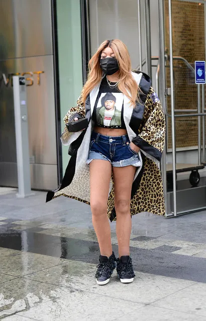 American broadcaster Wendy Williams heads off to work in New York City on June 8, 2021. The daytime TV talk show host wore a leopard print Supreme x Everlast boxing robe, Supreme “Nasty Nas” cropped t-shirt, denim cutoffs, fishnet tights, and black high top sneakers. (Photo by The Image Direct)
