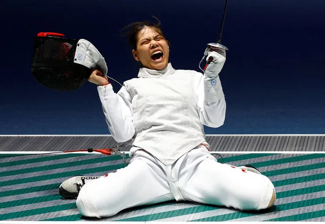 Huang Qianqian of Team China celebrates victory against Yuka Ueno of Team Japan in the Fencing - Women's Foil Individual Final on day two of the 19th Asian Games at Hangzhou Dianzi University Gymnasium on September 25, 2023 in Hangzhou, Zhejiang Province of China. (Photo by Kim Kyung-Hoon/Reuters)