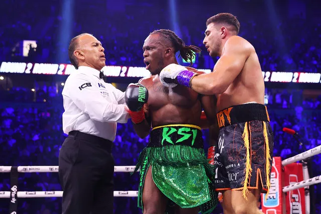 The referee breaks up KSI (Olajide Olayinka Williams) and Tommy Fury during the Misfits Cruiserweight fight between KSI (Olajide Olayinka Williams) and Tommy Fury at AO Arena on October 14, 2023 in Manchester, England. (Photo by Matt McNulty/Getty Images)