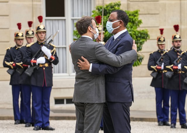 France's President Emmanuel Macron, left, welcomes Niger's President Mohamed Bazoum for a video-summit with leaders of the G5 Sahel at the Elysee Palace, Friday, July 9, 2021. (Photo by Michel Euler/AP Photo)