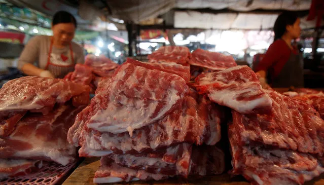 Sellers display pork for sale at a market in Hanoi, Vietnam December 5, 2016. (Photo by Reuters/Kham)