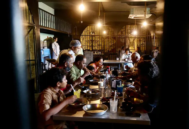 Customers enjoy dining at “Central Jail Restaurant” in Bangalore, India on November 1, 2023. People can experience dining in a prison-like facility at Bangalore's first unique prison-themed “Central Jail Restaurant” with iron rod grills. (Photo by Jagadeesh N.V./EPA/EFE)