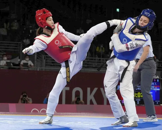 Japan Miyu Yamada, left, attacks Serbia's Tijana Bogdanović during the women's 49kg taekwondo match at the 2020 Summer Olympics, Saturday, July 24, 2021, in Tokyo, Japan. (Photo by Themba Hadebe/AP Photo)