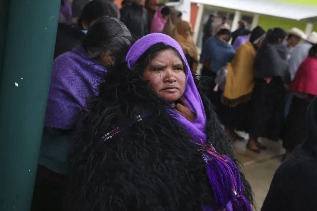 Indigenous Tzotzil women wait to vote in a non-binding national referendum on whether Mexican ex-presidents should be tried for any illegal acts during their time in office, in the Corazon de Maria community of Chiapas state, Mexico, Sunday, August 1, 2021. (Photo by Emilio Espejel/AP Photo)