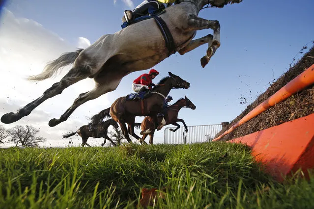General action as runners clear a fence at Taunton Racecourse on January 11, 2017 in Taunton, England. (Photo by Alan Crowhurst/Getty Images)