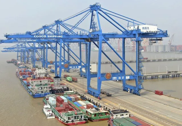 In this aerial photo, container ships are docked at a port on the Yangtze River in Nantong in eastern China's Jiangsu Province, Monday, September 6, 2021. China's import and export growth accelerated in August despite disruptions due to the spread of the coronavirus's delta variant. (Photo by Chinatopix via AP Photo)