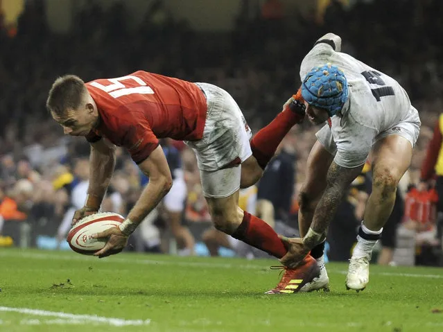 Wales Liam Williams is tackled by England's Jack Nowell during the Six Nations rugby union international between Wales and England at the Principality Stadium in Cardiff, Wales, Saturday, February 23, 2019. (Photo by Rui Vieira/AP Photo)