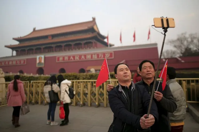 People take pictures of themselves at Tiananmen Gate as the area near the Great Hall of the People is prepared for upcoming annual sessions of the National People's Congress (NPC) and Chinese People's Political Consultative Conference (CPPCC) in Beijing March 3, 2016. (Photo by Aly Song/Reuters)