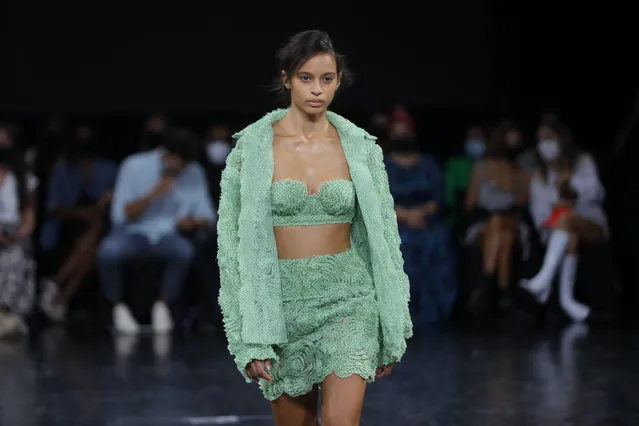 A model displays a creation by Portuguese fashion designer Goncalo Peixoto on the forth day of the Lisbon Fashion Week 2021, at the Capitolio in Lisbon, Portugal, 10 October 2021. (Photo by Miguel A. Lopes/EPA/EFE)