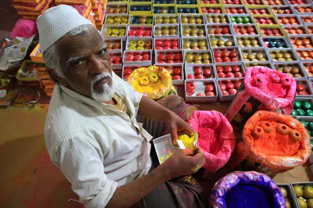 An Indian muslim artist Mohammad Avaz prepare the traditional Gulaal Gota “Colour Balls” which made by dry hygienic herbal colour “Abeer or Gulaal” ahead the Hindu Holi Festival celebration in Jaipur, Rajasthan, India on 18 March, 2019. Holi is a spring festival, also known as the festival of colours or the festival of sharing love and Joy. (Photo by Vishal Bhatnagar/NurPhoto via Getty Images)