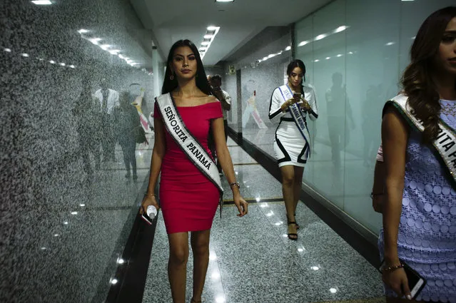 In this September 12, 2018, Miss Panama, Rosa Iveth Montezuma, left, leaves a visit to the Tourism Ministry in Panama City. Montezuma, is the first indigenous woman to win the “Miss Panama” beauty pageant. (Photo by Arnulfo Franco/AP Photo)