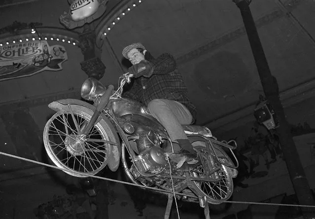 In this February 5, 1963 file photo, French actor Jean-Paul Belmondo rehearses his motorcycle tightrope act at the Medrano Circus in Paris. French New Wave actor Jean-Paul Belmondo has died, according to his lawyer’s office on Monday Sept. 6, 2021. (Photo by Jacques Marqueton/AP Photo/File)