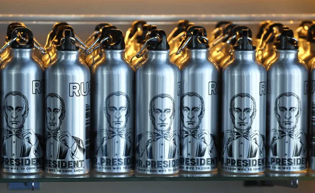Bottles for water showing portraits of Russian President Vladimir Putin are for sale during the anniversary ceremony of the PANORAMA-360 viewing platform on the 89th floor of the Federation Tower in Moscow, Russia, April 17, 2019. The viewing platform was officially opened on 21 April 2018 and was visited by more than 350,000 people last year. (Photo by Yuri Kochetkov//EPA/EFE)