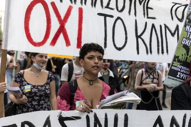 A protester chants slogans during a climate change rally in Athens, Greece, Saturday, November 6, 2021. (Photo by Yorgos Karahalis/AP Photo)