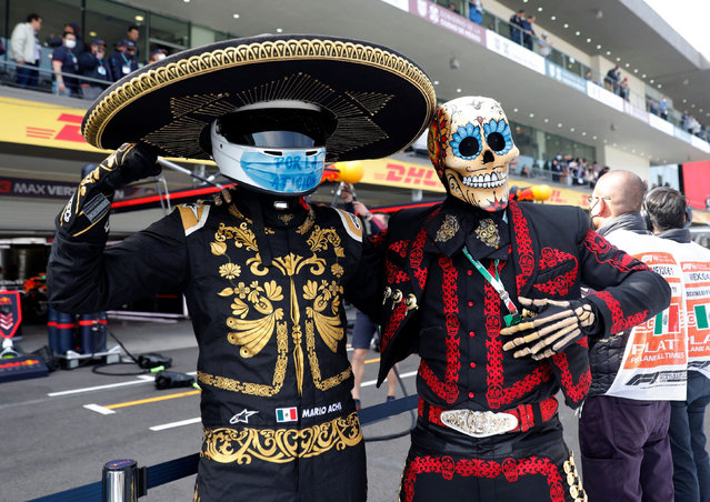 El Mariachi and Fermin in the pits at a qualifying session for the Mexican Grand Prix in Mexico City, Mexico on November 6, 2021. (Photo by Andres Stapff/Reuters)