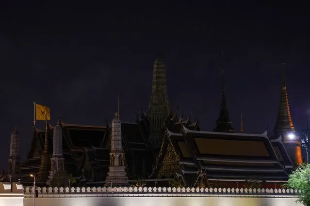 The Grand Palace is seen with lights off during Earth Hour in Bangkok, Thailand on March 23, 2024. (Photo by Chalinee Thirasupa/Reuters)