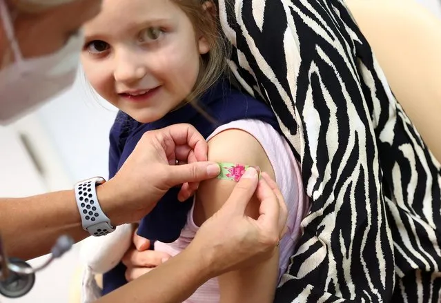 Luna smiles after getting a dose of the Pfizer-BioNTech vaccine against the coronavirus disease (COVID-19) for children at a children doctor's practice in Maintal near Frankfurt, Germany, December 15, 2021. (Photo by Kai Pfaffenbach/Reuters)