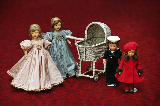 Dolls and a pram belonging to Queen Elizabeth II are displayed at Buckingham Palace ahead of the Royal Childhood exhibition on April 2, 2014 in London, England. (Photo by Peter Macdiarmid/Getty Images)